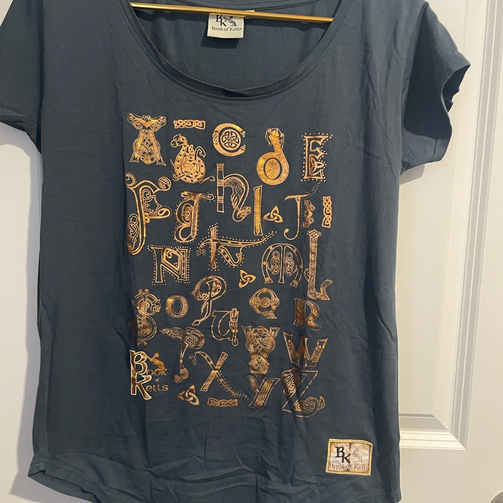 Woman’s Blue Gray Book of Kells Sz M T-Shirt with Gold Print and cap sleeves.